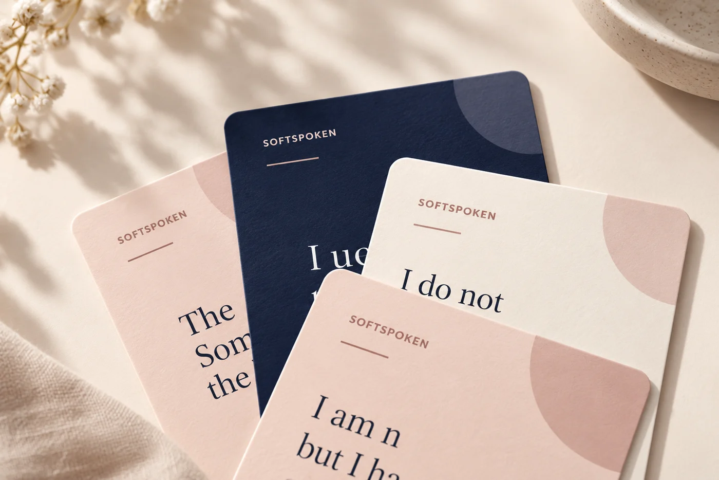 A protected preview of four overlapping Calm Again cards in navy, blush and cream
